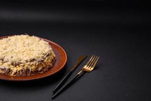 Delicious fresh pie with chicken liver, eggs, onions, carrots and mayonnaise photo