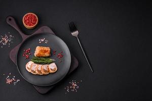 Delicious chicken or pork meat roll with mushrooms, cheese, spices and herbs photo