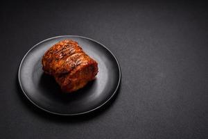 Delicious fresh smoked meat or ham with spices and herbs photo