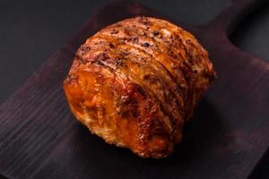 Delicious fresh smoked meat or ham with spices and herbs photo