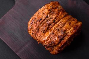 Delicious fresh smoked meat or ham with spices and herbs photo
