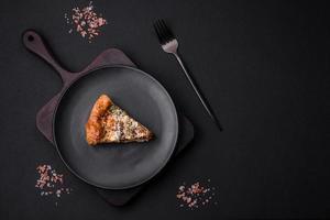 Delicious quiche with chicken, cheese, herbs, spices and herbs photo