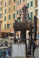 rugged iron old crane in Mediterranean Harbor photo