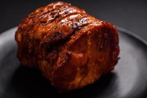 Delicious fresh smoked meat or ham with spices and herbs photo