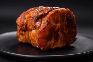 Delicious fresh smoked meat or ham with spices and herbs photo