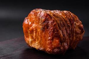 Delicious fresh smoked meat or ham with spices and herbs photo