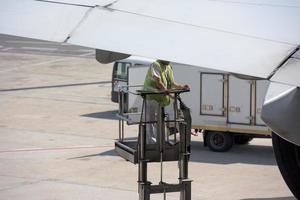 airplane main gear while serviced photo