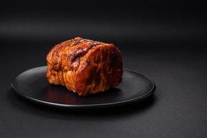 Delicious fresh smoked meat or ham with spices and herbs photo