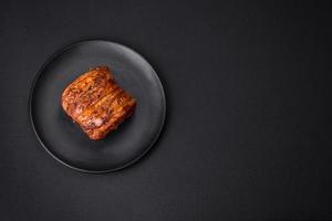 Delicious fresh smoked meat or ham with spices and herbs photo