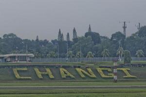 Singapur aeropuerto césped firmar foto