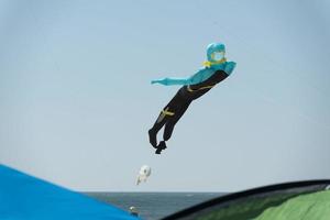 Scuba diver kite on the sky background photo