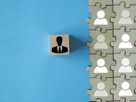 Personnel selection human resource management person icon on wooden block who was selected as a team leader in the work photo