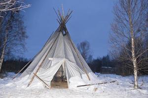 teepee in the snow background photo