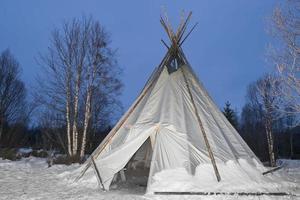 teepee in the snow background photo