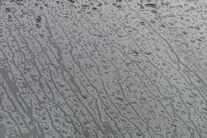 rain on car glass window photo