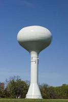 A water tower in the deep blue sky photo