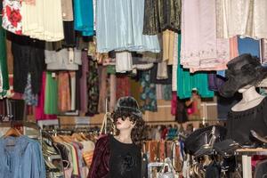 Vintage clothes for sale inside a shop photo