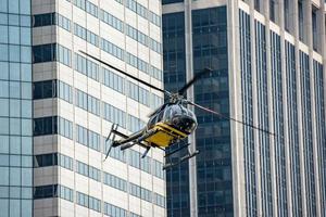 Helicopter on manhattan building background photo