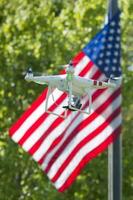 A security drone on stars and stripes USA flag photo