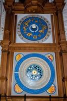 Ancient perpetual clock calendar on wood photo