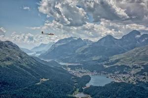 glider over swiss alps glacier view in Engadina photo