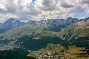 glider over swiss alps glacier view in Engadina photo