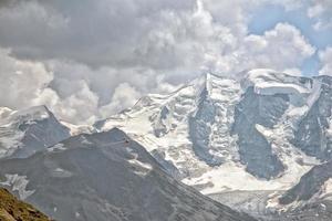 glider over swiss alps glacier view in Engadina photo