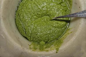 pesto sauce in marble mortar photo