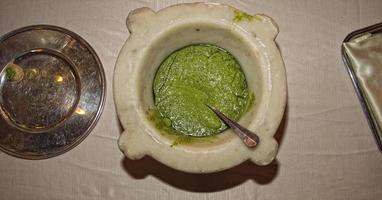 pesto sauce in marble mortar photo