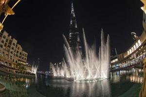 Burji Khalifa at night with fountain show the highest building in the world photo