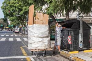 man searching in the rubbish photo