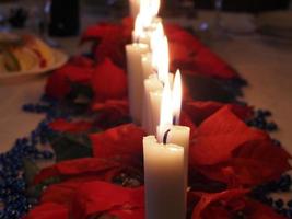Christmas candles on the table photo