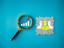 Team growth or team search to find work that makes it successful teamwork with people icon on jigsaw puzzle photo