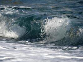 Sea wave on the shore photo