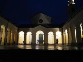 Night view of Madonna della Guardia votive offering sanctuary on Genoa mountain hill church photo