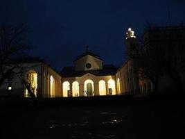 Night view of Madonna della Guardia votive offering sanctuary on Genoa mountain hill church photo