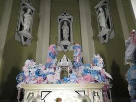 GENOA, ITALY - DECEMBER 25 2021 - Madonna della Guardia votive offering sanctuary on Genoa mountain hill church for baby birth photo