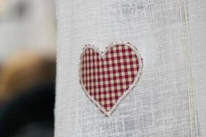 valentine day red heart on white curtain photo