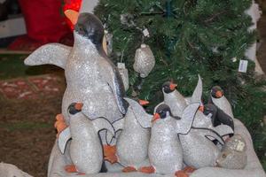 penguin christmas decorations at street market photo