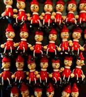 A group of Pinocchio puppets souvenir from Italy photo