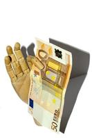 Wooden hand holding euro currency photo