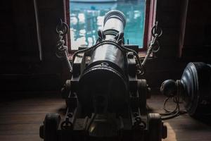 iron cannon on sail ship photo