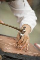 hands working copper photo