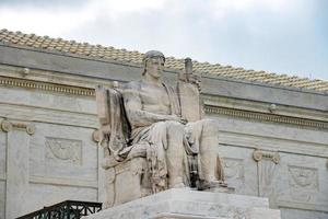 Statue of law outside Supreme Court building in Washington photo