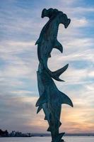 hammerhead shark statue at sunset photo