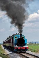 steam engine train while coming to you photo