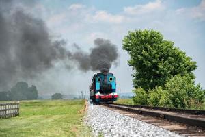 steam engine train while coming to you photo