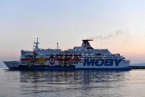 GENOA, ITALY - JULY 27 2017 - Cruise ship sailing from harbor photo