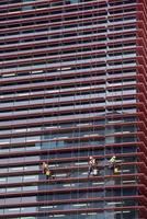 window cleaner climber on skyscraper photo