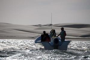 fisherman boat Magdalena Bay mexico near sand dunes photo